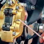 Bleeding the brake system and replacing brake fluid on a motorcycle